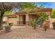 Inviting home exterior featuring desert landscaping and a covered entryway at 2610 E Leiber Ln, Phoenix, AZ 85024