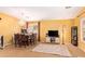 Spacious living area featuring carpet, a chandelier, and large windows for natural light at 2610 E Leiber Ln, Phoenix, AZ 85024