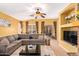 Cozy living room with a sectional sofa, ceiling fan, and access to the backyard at 2610 E Leiber Ln, Phoenix, AZ 85024