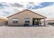 View of backyard with patio, desert landscaping, and privacy wall at 3264 E Luna Dr, San Tan Valley, AZ 85143