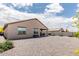 Spacious backyard features low-maintenance desert landscaping and covered patio at 3264 E Luna Dr, San Tan Valley, AZ 85143