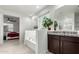Bathroom featuring a vanity, tub, and a decorative privacy glass window at 3264 E Luna Dr, San Tan Valley, AZ 85143