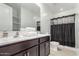 Bathroom featuring double sinks, vanity and bathtub with shower at 3264 E Luna Dr, San Tan Valley, AZ 85143