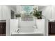Bathtub and vanity with a granite countertop under a decorative privacy glass window at 3264 E Luna Dr, San Tan Valley, AZ 85143