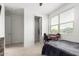 Bedroom with a desk, ceiling fan, and walk-in closet at 3264 E Luna Dr, San Tan Valley, AZ 85143