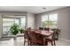 Inviting dining area featuring a large window and sliding glass door leading to the backyard at 3264 E Luna Dr, San Tan Valley, AZ 85143