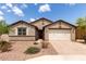 Charming single-story home featuring a well-maintained front yard and a two-car garage at 3264 E Luna Dr, San Tan Valley, AZ 85143