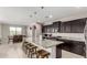 Modern kitchen with granite countertops, stainless steel appliances, and a spacious center island at 3264 E Luna Dr, San Tan Valley, AZ 85143