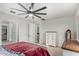 Bright main bedroom with a ceiling fan, closet, and ensuite bathroom at 3264 E Luna Dr, San Tan Valley, AZ 85143