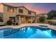 Inviting backyard showcasing a private pool, spa, covered patio, and lush landscaping, perfect for outdoor enjoyment at 35206 N 27Th Ave, Phoenix, AZ 85086