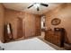 Bedroom featuring two closets, carpet, a queen bed and a ceiling fan at 35206 N 27Th Ave, Phoenix, AZ 85086