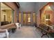 Charming courtyard featuring double front doors, seating, plants and views into the home at 35206 N 27Th Ave, Phoenix, AZ 85086