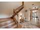 Open foyer features hardwood staircase, tiled floors, and a decorative light fixture at 35206 N 27Th Ave, Phoenix, AZ 85086