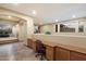 Upper hallway features built-in desk, cabinets, tile floor and open access to the lower-level theater room at 35206 N 27Th Ave, Phoenix, AZ 85086