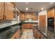Well-equipped kitchen with oak cabinets, tile backsplash, and sleek appliances offering both style and functionality at 35206 N 27Th Ave, Phoenix, AZ 85086