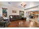 Spacious living room features a comfortable sectional, ceiling fan, and great natural light at 35206 N 27Th Ave, Phoenix, AZ 85086