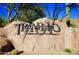 A welcoming community entrance sign with desert landscaping and blue sky background at 35206 N 27Th Ave, Phoenix, AZ 85086