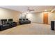 Spacious carpeted theater room with multiple leather recliners, ceiling fan, and recessed lighting at 35206 N 27Th Ave, Phoenix, AZ 85086