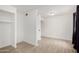An open bedroom space with wood-look floors and a large storage space at 3646 N 67Th Ave # 20, Phoenix, AZ 85033