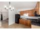 Bright kitchen space with a black refrigerator and backyard views at 3646 N 67Th Ave # 20, Phoenix, AZ 85033