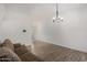 Open living space with combined tile and wood-look floors at 3646 N 67Th Ave # 20, Phoenix, AZ 85033