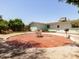 Expansive backyard with a large brick patio, green lawn, and mature trees, perfect for outdoor enjoyment at 3741 W Davidson Ln, Phoenix, AZ 85051