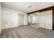 Spacious bedroom with mirrored wall, closet, and view into the adjoining bathroom at 3741 W Davidson Ln, Phoenix, AZ 85051