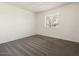 Clean bedroom featuring carpet, white walls, and a single window at 3741 W Davidson Ln, Phoenix, AZ 85051