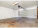 Spacious garage featuring concrete flooring, ample room for storage, and a functional garage door at 3741 W Davidson Ln, Phoenix, AZ 85051