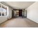 Open-concept room showcases a seamless transition to the entryway, enhanced by ample natural light and neutral decor at 3741 W Davidson Ln, Phoenix, AZ 85051
