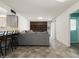Inviting living room featuring a large couch, open to the kitchen, offering a comfortable living space at 3741 W Davidson Ln, Phoenix, AZ 85051