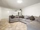 Inviting living room showcasing neutral walls and flooring, open to the kitchen and dining at 3741 W Davidson Ln, Phoenix, AZ 85051