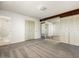 Spacious main bedroom with carpet, white walls, and a connecting bathroom and mirrored closet space at 3741 W Davidson Ln, Phoenix, AZ 85051