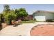 Backyard patio area featuring decorative brickwork and comfortable outdoor seating at 3741 W Davidson Ln, Phoenix, AZ 85051