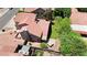 Aerial view of a home with a red tile roof, landscaped backyard, and a small jacuzzi in the corner at 3926 E Lavender Ln, Phoenix, AZ 85044