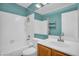 Well-lit bathroom with a tub, shower and a modern sink at 3926 E Lavender Ln, Phoenix, AZ 85044