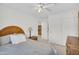 Cozy bedroom with a ceiling fan, closet and a view to an adjacent room at 3926 E Lavender Ln, Phoenix, AZ 85044