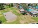 Aerial view of the community pool and volleyball court near green lawns and recreation areas at 3926 E Lavender Ln, Phoenix, AZ 85044