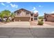 Charming two-story home featuring a three-car garage, desert landscaping, and a cozy residential neighborhood at 3926 E Lavender Ln, Phoenix, AZ 85044
