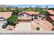 Beautiful two-story home featuring a spacious three-car garage and well-manicured desert landscaping at 3926 E Lavender Ln, Phoenix, AZ 85044