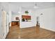 Bright living area with wood floors and easy access to the kitchen at 3926 E Lavender Ln, Phoenix, AZ 85044