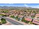 Aerial shot of neighborhood homes nestled amongst the desert landscape at 3926 E Lavender Ln, Phoenix, AZ 85044