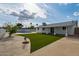 Spacious backyard featuring a well-maintained lawn and a pool area for outdoor enjoyment at 405 E Cornell Dr, Tempe, AZ 85283