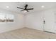 Bedroom with a new ceiling fan, window and laminate wood floors at 405 E Cornell Dr, Tempe, AZ 85283