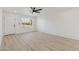 Bright bedroom with a ceiling fan and wood-look floors at 405 E Cornell Dr, Tempe, AZ 85283