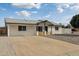 Charming home featuring a neutral brick exterior and a spacious concrete driveway at 405 E Cornell Dr, Tempe, AZ 85283