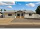 Charming single-story home with a tidy front yard and white brick exterior at 405 E Cornell Dr, Tempe, AZ 85283
