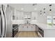 Well-lit kitchen with stylish countertops, stainless appliances, and ample cabinet space at 405 E Cornell Dr, Tempe, AZ 85283
