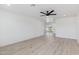 Spacious living room with wood floors and a large sliding door at 405 E Cornell Dr, Tempe, AZ 85283