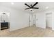 Primary bedroom featuring wood-look floors with ensuite bathroom and closet at 405 E Cornell Dr, Tempe, AZ 85283